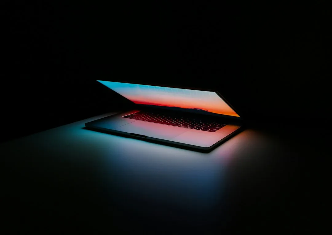 An open laptop computer on a smooth surface
