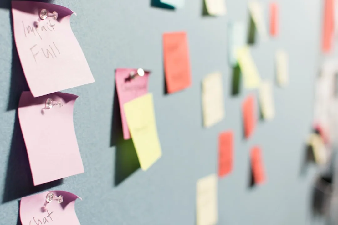 Colourful sticky notes pinned to a board