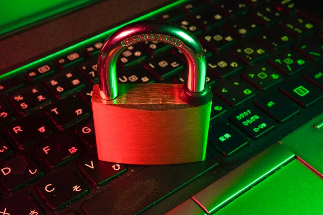 A red padlock on a black keyboard