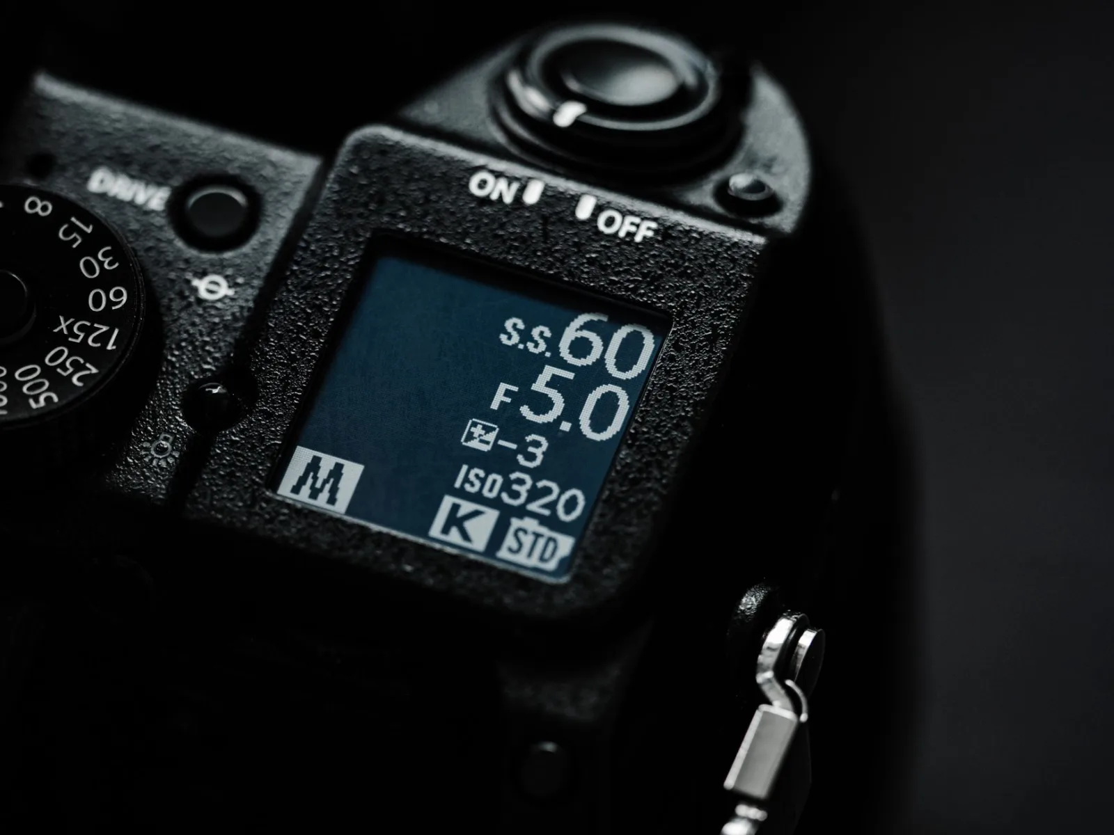 A close-up of a camera screen showing the shooting settings